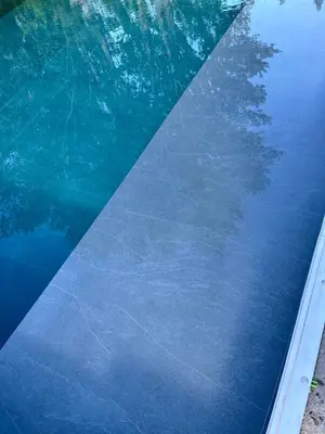 a pool of water with a reflection of a tree in it at La provence avec piscine privative en campagne in Pernes-les-Fontaines