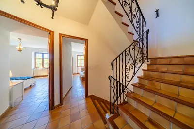 a hallway with stairs leading to a bedroom at La Maison de Sophie in Châteauneuf-de-Gadagne