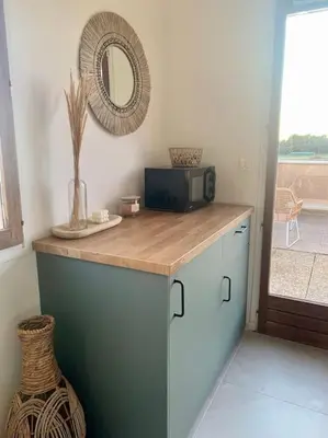 a kitchen with a counter with a microwave and a mirror at Provensa - love room avec balneo et terrasse avec vue in Pertuis