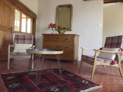 a room with a table and two chairs and a dresser at LE GRAIN DE LAVANDE - Mont Ventoux in Sault-de-Vaucluse