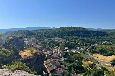 an aerial view of a small village in the mountains at Camping Le Luberon in Apt