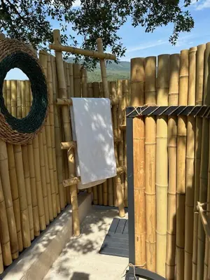 a wooden fence with a sign in front of it at Gîte des Pape in Bédoin