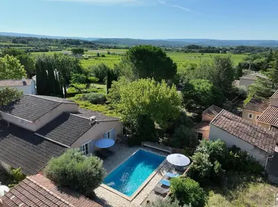 an aerial view of a house with a swimming pool at The Olive Garden - Charming Villa for 10 with pool and fast Wifi in Caromb