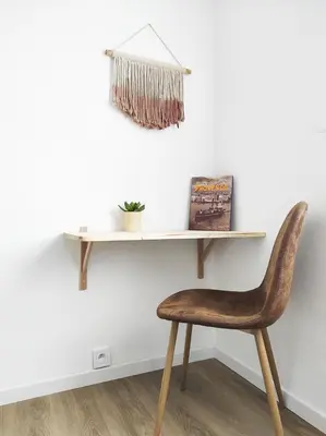 a wooden chair sitting under a shelf on a wall at Le Cosy Valcros, design et confort in Aix-en-Provence
