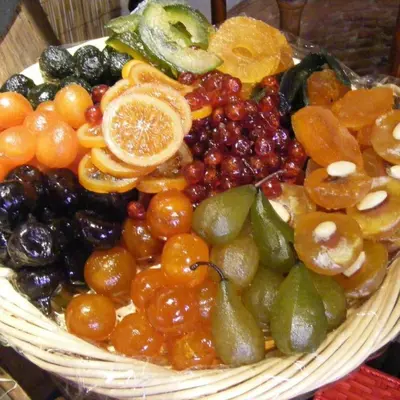 a basket of fruits and vegetables on a table at la petite maison in Céreste