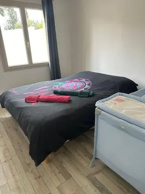 a bed in a room with two towels on it at maison_du_sud_13140 in Miramas
