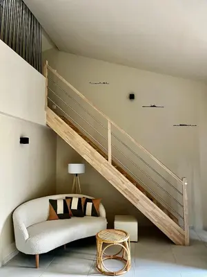 a living room with a loft bed and a couch at Le capèu in Mollégès