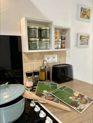 a kitchen with a counter top with some food on it at La glycine in Saint-Marc-Jaumegarde