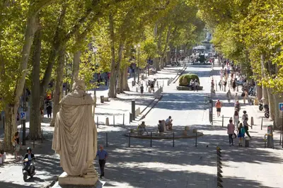 a statue of a woman in a park with trees at Le Yona Mirabeau - Appartement T3 Atypique situé dans le centre ville historique - proche Rotonde in Aix-en-Provence