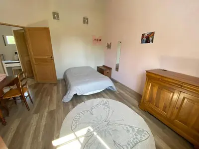 a small room with a bed and a table and a table sidx sidx at Le bon Vivre in Aix-en-Provence