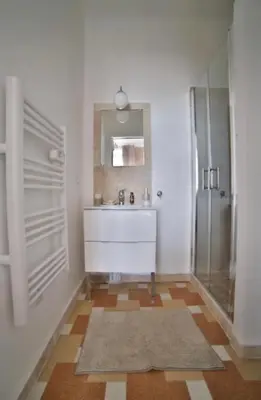 a bathroom with a sink and a mirror at La Cassiopée in Caromb