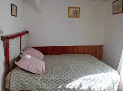 a bedroom with a bed with two pillows at Appartement charmant à Aix-en-Provence - 48m² - Balcon privé in Aix-en-Provence