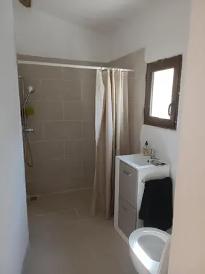 a bathroom with a toilet and a shower and a sink at Lou Boulugi in Aix-en-Provence