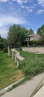 a grave yard with a house in the background at Lou Boulugi in Aix-en-Provence