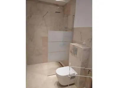 a bathroom with a toilet and a shower at Camargue Modern retreat in Cavaillon