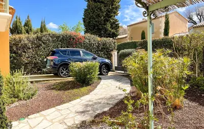 a blue car parked in front of a house at Awesome Home In Saint-Rémy-De-Provence in Saint-Rémy-de-Provence