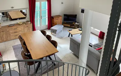 a living room with a table and a couch at Awesome Home In Saint-Rémy-De-Provence in Saint-Rémy-de-Provence