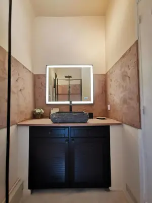 a bathroom with a sink and a mirror at Appartement centre historique Aix en Provence, Place RAMUS in Aix-en-Provence
