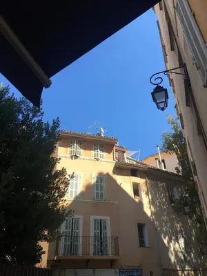 a building with a blue sky in the background at AIX Centre LOFT Duplex Terrasse climatisation wifi in Aix-en-Provence