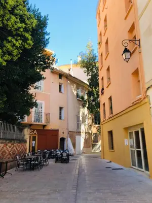 an empty street with tables and chairs and buildings at AIX Centre LOFT Duplex Terrasse climatisation wifi in Aix-en-Provence