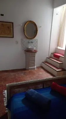 a bedroom with a sink and a mirror on the wall at Clos des Jasmins avec sa jolie cour intérieure in Lourmarin