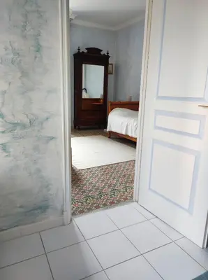 a room with a door leading to a bedroom at Chambre 3 personnes avec salle de bain dans mas du Lubéron in Robion en Luberon
