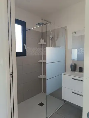 a kitchen and dining room with a table and chairs at La Cigale sous l'Olivier - Chambre , SdB et Salon Privé - Piscine in Les Taillades