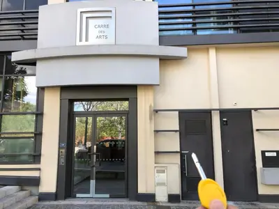 a person holding a frisbee in front of a building at ITER House \uc774\ud130 \ud558\uc6b0\uc2a4 in Aix-en-Provence