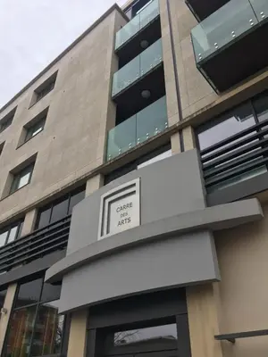 a building with a sign that reads cancer axis at ITER House \uc774\ud130 \ud558\uc6b0\uc2a4 in Aix-en-Provence