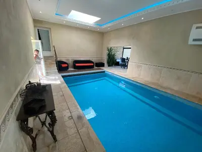 a swimming pool with a large blue pool at Les Pres de Gordes in Gordes