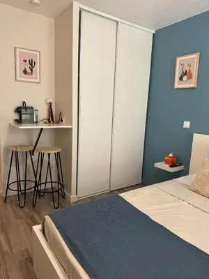 a bedroom with a bed and a table and a desk at 014 Studio Provençal - Proche d'Aix en Provence in Éguilles