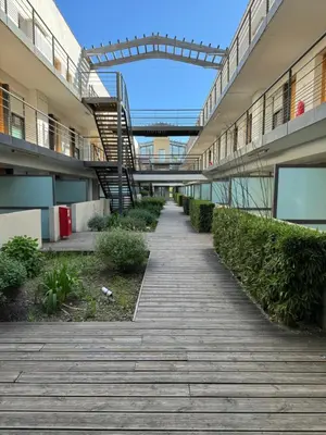 an empty walkway in a building with a staircase at 014 Studio Provençal - Proche d'Aix en Provence in Éguilles