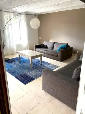 a living room with a couch and a coffee table at Villa élégante à Cavaillon avec piscine in Cavaillon
