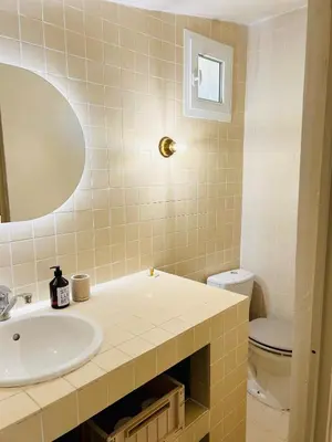 a bathroom with a sink and a toilet at Maison Joucas in Joucas