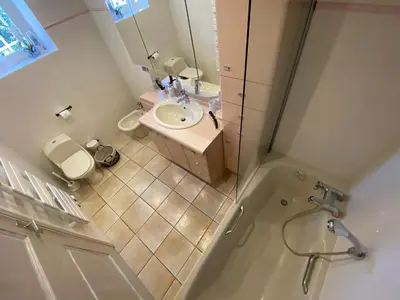 a bathroom with a sink and a shower and a toilet at La maison de Inna in Bonnieux