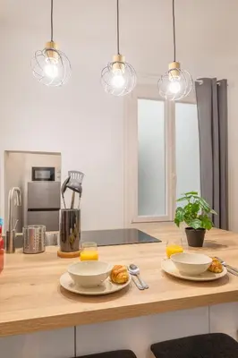 a kitchen with two plates of food on a counter at Studio Aixois Mezzanine in Aix-en-Provence