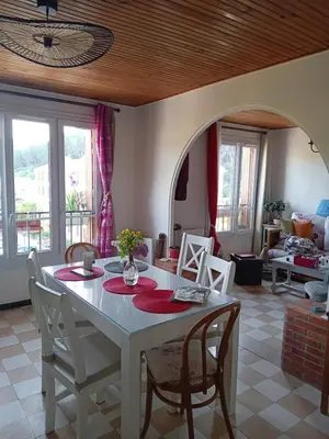 a dining room with a table and chairs and a room at T3 campagne Aix-en-Provence in Meyrargues
