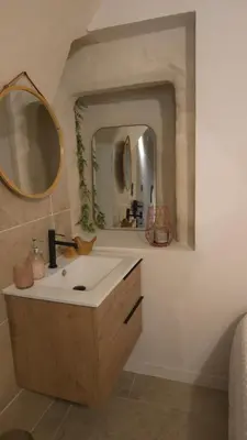 a bathroom with a sink and a mirror at Petit bonheur in Lauris