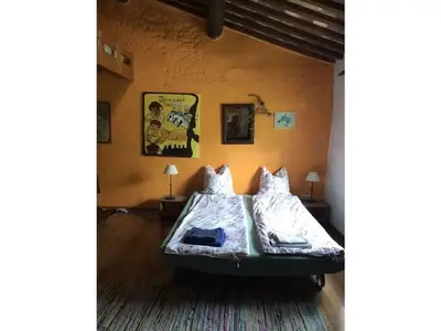 a bedroom with two beds in a room at Oud Wijnhuis Mas in Sénas