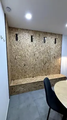 a room with a wall with a table and a chair at Très bel appartement climatisé - Chez Tom et Anna in Bédoin