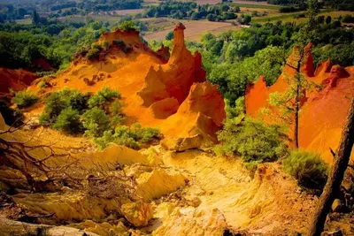 a painting of a mountain with trees and rocks at Odette du Colorado, vue sur le colorado, jacuzzi, boisé in Rustrel