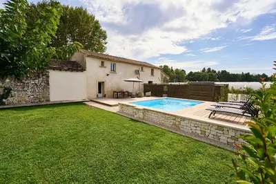 a backyard with a swimming pool and a house at Maison avec jardin in Pernes-les-Fontaines