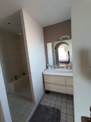 a bathroom with a tub and a sink and a mirror at Villa Reillanne Luberon in Reillanne