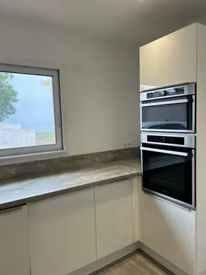 a kitchen with a stove and a window at Pitchoun in Velaux