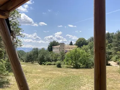 a view from a window of a building in a field at La Grisonne Chalet 1 in Revest-du-Bion