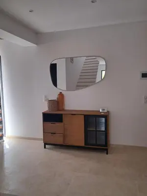 a room with a dresser and a mirror on the wall at Villa SOFIA in Saint-Saturnin-les-Apt