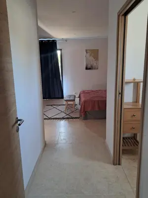 a view of a bedroom with a bed and a door at Villa SOFIA in Saint-Saturnin-les-Apt