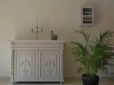 a white cabinet in a room with a plant at Farmhouse in Carpentras with Pool in Carpentras