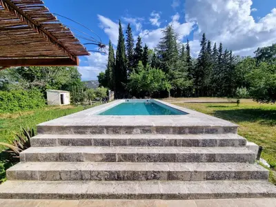 a set of stairs leading to a swimming pool at Les copains d'abord ! in Lacoste