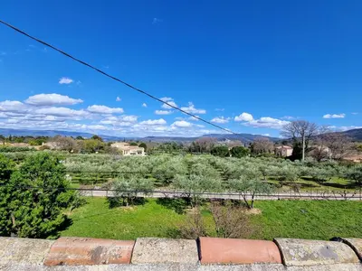 a view of a field with a fence at Les copains d'abord ! in Lacoste